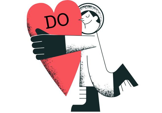 A man hugging a heart with «Do» written on him